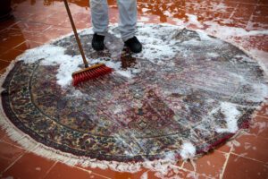 A Worker is Cleaning an Area Rug — Williamsburg, VA — Conscientious Carpet Care